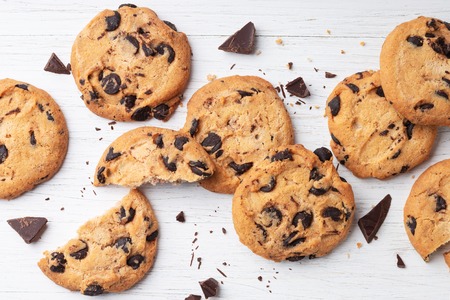 American cookies with chocolate chips on white wooden background. Top view.の写真素材