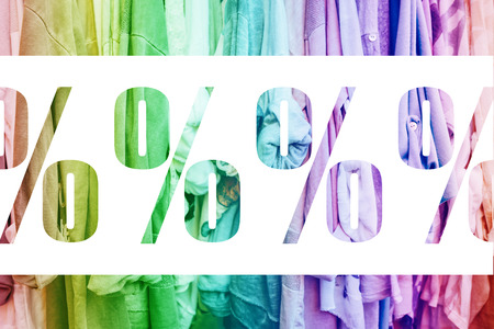 Rainbow background with jersey womans clothes in shop. Discount concept.の写真素材