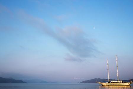 Sunrise in bay of sea. Morning haze, beautiful view on mountains and sea.の写真素材