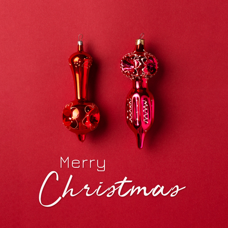 Christmas and New Year vintage greeting card with decorations on red background. Minimal styled, holiday.の写真素材