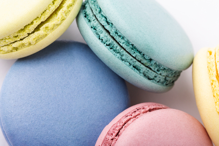 Colorful macarons on white background. Top view, close up.の写真素材