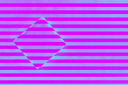 Top view of gift box wrapped in striped paper on striped paper. Trendy neon minimal concept background.の写真素材