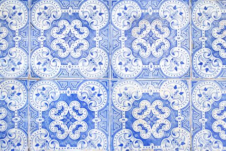 Traditional ornate portuguese decorative tiles azulejos in white and blue colours.