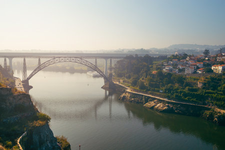 Porto, Portugal - August 2019: Ponte de D. Maria Pia at sunrise on the Douro River.のeditorial素材