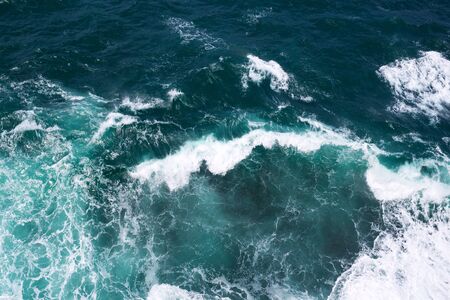 Top view on ocean waves and foam.の写真素材