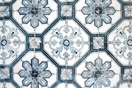 Traditional ornate portuguese decorative tiles azulejos in white, green, blue and black colours.の写真素材