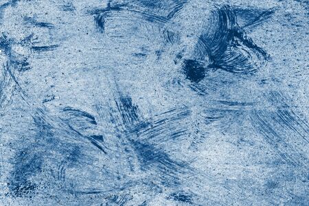 Texture of rusty painted wall in classic blue color. Background painted in trendy color of 2020.の写真素材