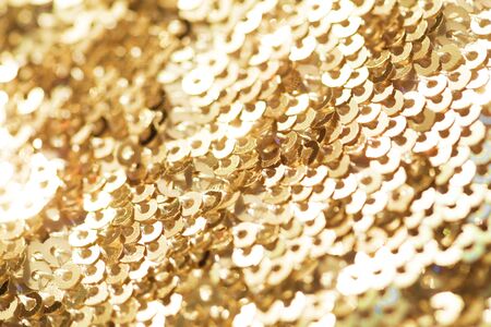 Sparkling golden sequined fabric.の写真素材