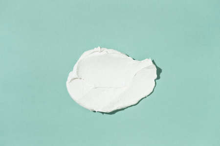 Smear of white clay face mask. Top view.の写真素材