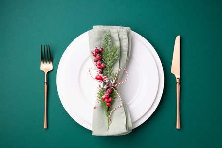 Christmas setting table on green background. Top view.の写真素材