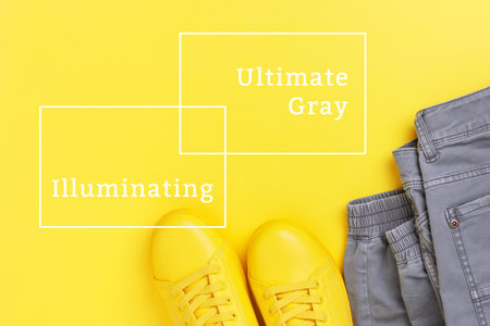 Yellow shoes with gray jeans on yellow background with inscriptions. Top view, trendy colors.の写真素材