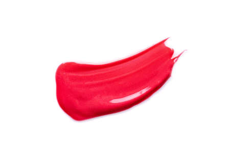 Red lipstick smear isolated on white.の写真素材