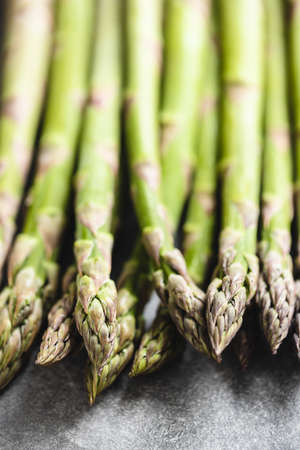 Fresh asparagus on gray table, close up.の写真素材
