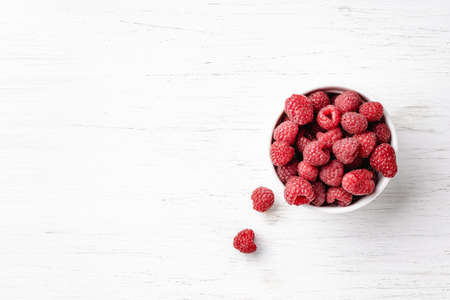Raspberries in bowl on white background.の写真素材