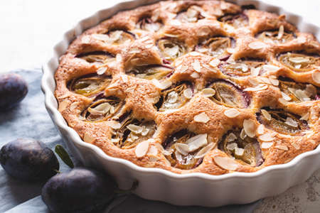 Closeup of raditional American plum torte on white table.の写真素材