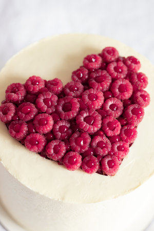 Cake with raspberry's viva magenta heart decor.の写真素材