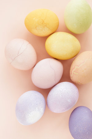 Natural dying Easter eggs on peach background. easter greeting card.の写真素材