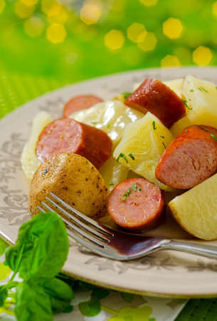 A boiled cabbage dinner with smoked sausage and potatoe.の写真素材