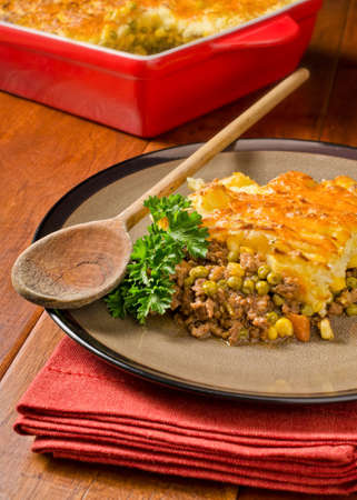 A hot and hearty shepherd's pie with cheddar cheese.の写真素材