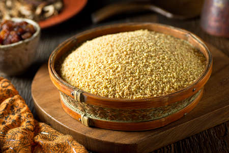A bowl of raw organic couscous.の写真素材