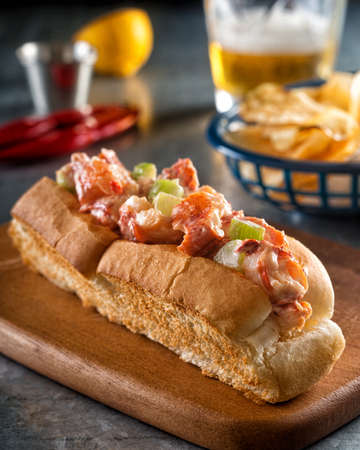 A delicious east coast lobster roll with celery and mayonnaise on a toasted bun.の写真素材