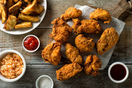 Delicious homemade crispy fried chicken with taters and coleslaw.
