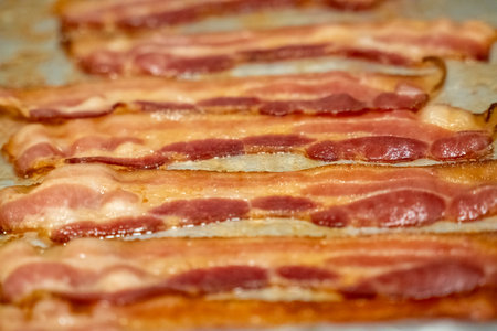 Close up view of bacon on a baking sheetの写真素材