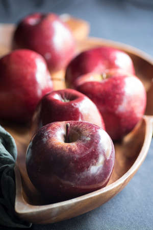 Apples very red and bright, appetizing, on a table