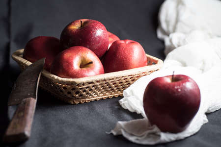 Apples very red and bright, appetizing, on a tableの写真素材