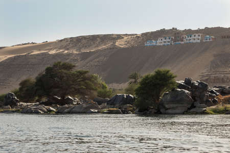 Entrance of the Nile River as it passes through the Nubian People in Aswan, Egypt, Afriaca. Amazing landscape of water and vegetation next to the desert.の写真素材