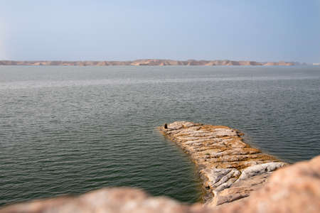 Lake Nasser next to Abu Simbel in Egypt, with its calm waters, large expanse, next to the desertの写真素材