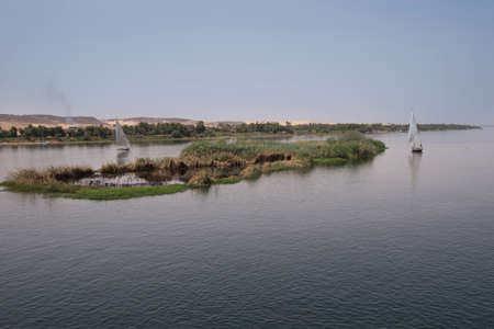 Feluccas on the Nile river in aswan Egypt on a hot dayの写真素材