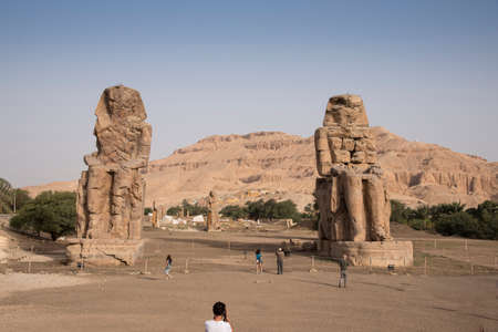 The Colossi of Memnon in Luxor, Egypt, Africa. Statues eighteen meters high, remains of the funerary temple of Amenhotep IIIのeditorial素材