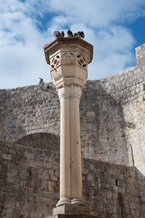 Stone decorations on the entrance ramp through the stone wall to the old town of Dubrovnik, Croatia,...