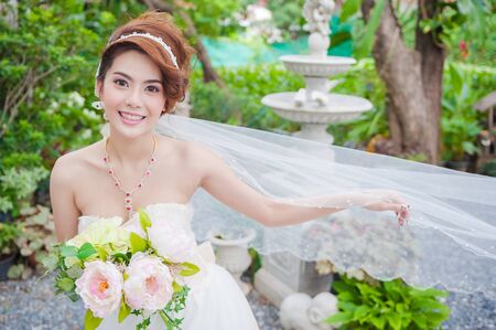 Beautiful Asian Woman wear a wedding dressの写真素材