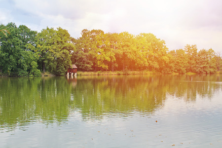 Pond with trees and granary building, Czech landscapeの写真素材