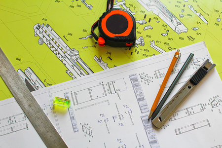 Plan with pencil, compasses, knife, water level, meter and steel ruleの写真素材