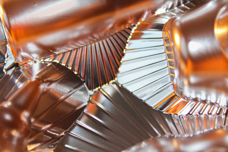 Abstract silver and bronze shine metal background with linesの写真素材