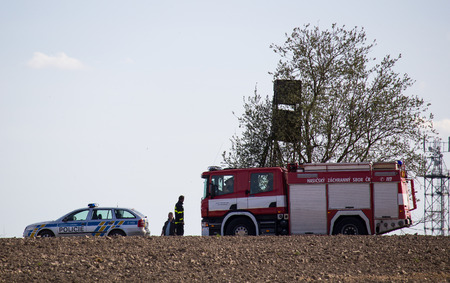VITIN, CZECH REPUBLIC - 14 April, 2018: Firework and police department checking stack of hay in...