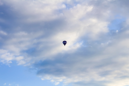 Colorful hoit air ballon fly on blue cloudy skyの写真素材