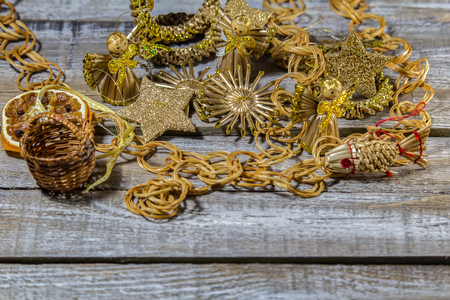 Straw golden glitter christmas bethlehem on wood backgroundの写真素材