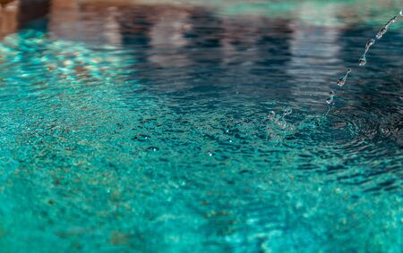 Close up detail of water texture in fountain, clear fresh waterの写真素材