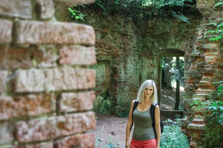 Portrait of caucasian beauty blonde young woman in old building ruin, Czech repubicの写真素材