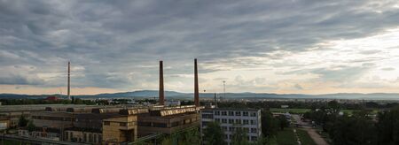 Panoramic view to city Ceske Budejovice in sunset with old foundryの写真素材