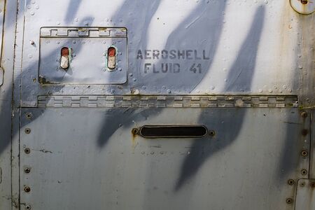Texture of old jet plane with tiger camouflage and Aeroshell fluid