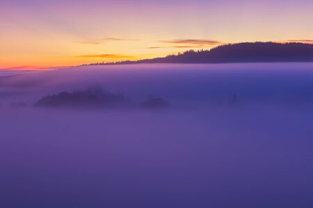 Detail of nice autumn misty fog and hill in sunrise, Czech landscapeの写真素材