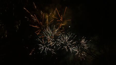 Amazing orange fireworks on night dark sky. New years eve celebration. Ceske Budejovice, Czech republicの写真素材