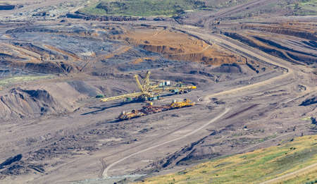 Aerial view to quarry Komorany with machine. Czech republic landscape