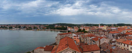 Panoramic aerial view to Croatia city Porec with cloudy skyの写真素材