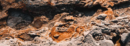 Panoramic lava stone, rock texture. Colored background, copy space